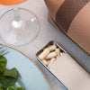 Neurogan Health Dihydromyricetin capsules in a bottle, shown alongside a glass of water, on a lifestyle background.