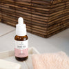 Neurogan Health GHK-Cu Copper Peptide Neck and Face Serum bottle with serum applicator on a skincare table.