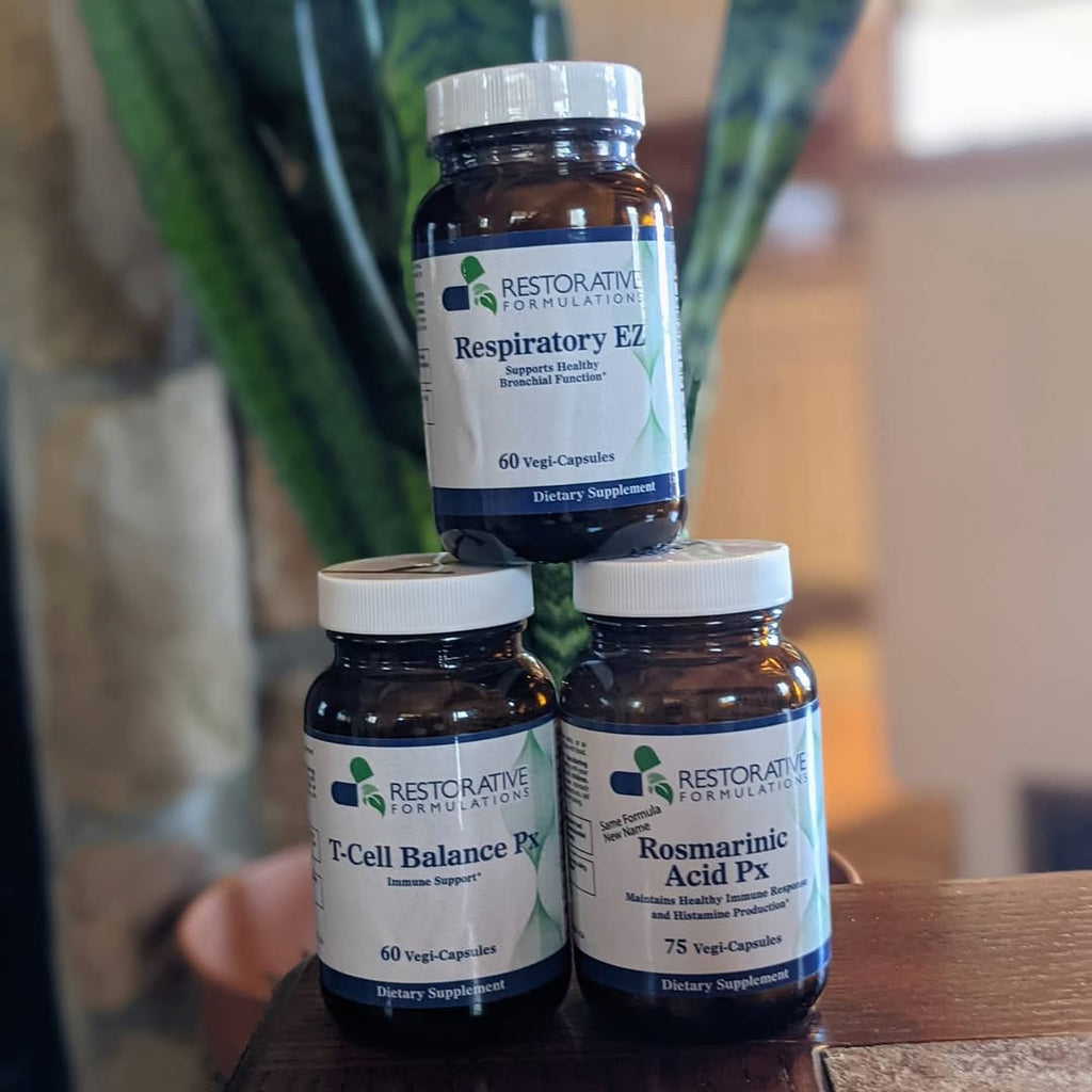 Bottle of Restorative Formulations T-Cell Balance Px 60 capsules with green and white label and capsules visible inside.